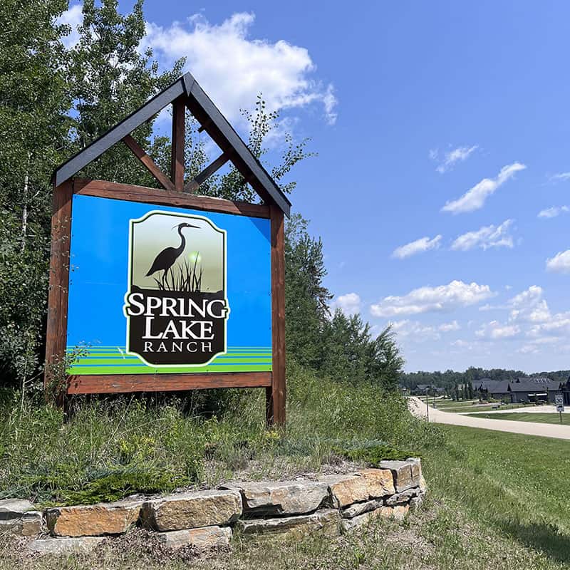 Sign for Spring Lake Ranch at the entrance to the community on a Summer Day