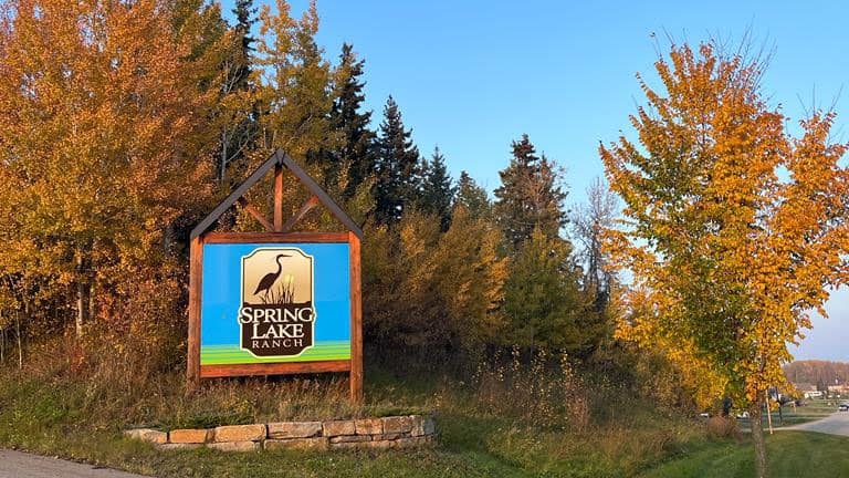 Spring Lake Ranch entrance sign with fall colours on the trees taken in October 2023